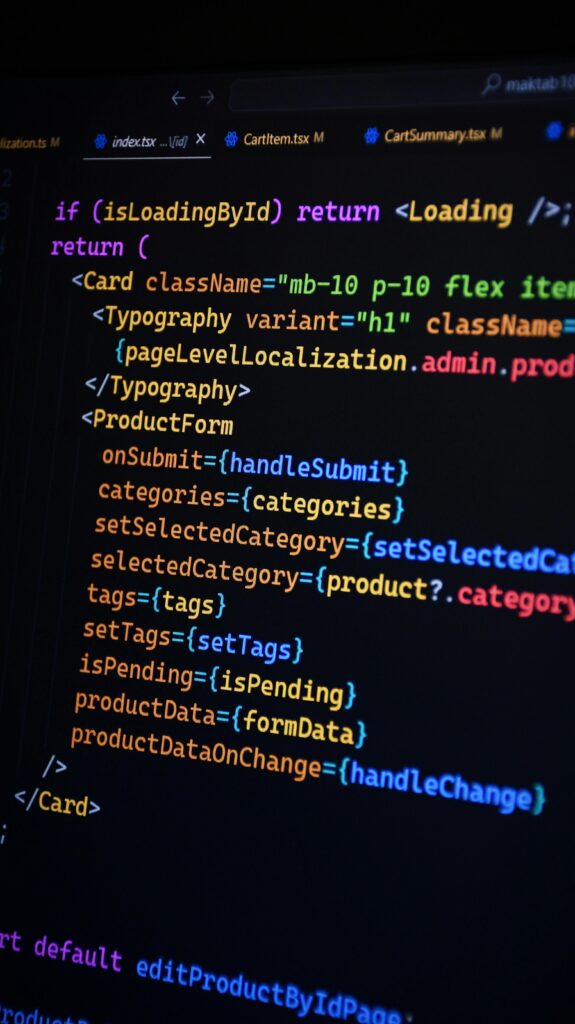 pexels-photo-29459444-29459444 Close-up of JSX code on a monitor, showcasing colorful syntax used in ReactJS development.